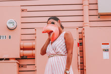 Load image into Gallery viewer, Owner Ashlee holds a Giant Fortunate Cookie up for size reference